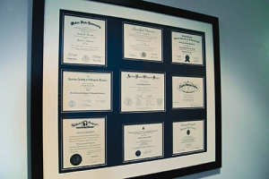A wall of medical certificates.